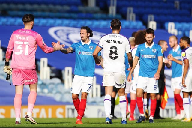 Pompey shake hands after their draw with Shrewsbury. Picture: Joe Pepler