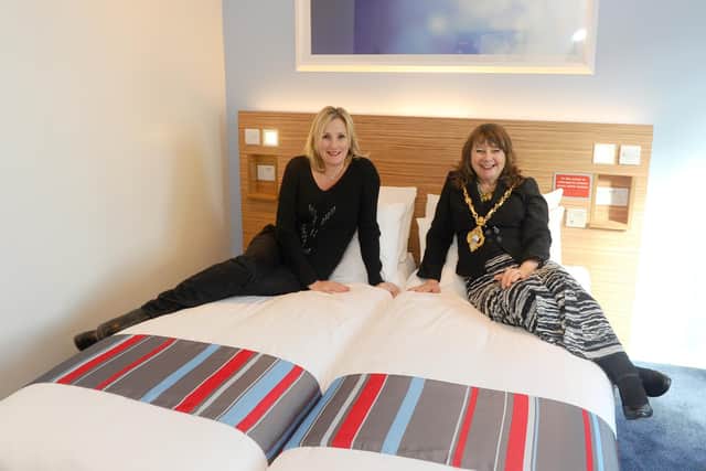 Gosport MP Caroline Dinenage and the mayor of Gosport Cllr Kathleen Jones try out the beds in the new Travelodge. Picture: Sarah Standing (270220-8902)