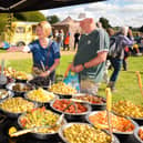 Pictured is:  Ann and Ray purchase some of the delicious olives from stall at the South Downs Food Festival Picture: Keith Woodland (140921-17)