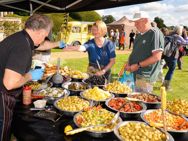 Pictured is:  Ann and Ray purchase some of the delicious olives from stall at the South Downs Food Festival Picture: Keith Woodland (140921-17)