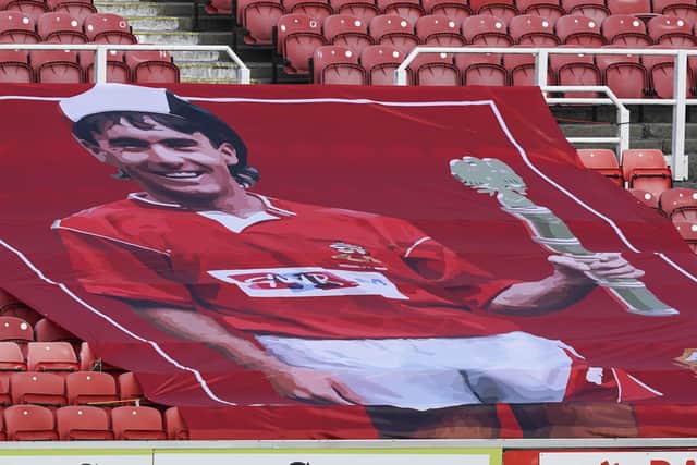 A flag of Alan McLoughlin was present at the County Ground for Pompey's trip to Swindon. Picture: Jason Brown