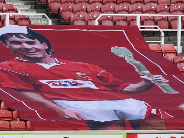 A flag of Alan McLoughlin was present at the County Ground for Pompey's trip to Swindon. Picture: Jason Brown