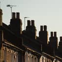 Chimneys on a row of terraced residential houses. Photo credit: Dominic Lipinski/PA Wire