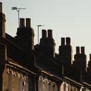 Chimneys on a row of terraced residential houses. Photo credit: Dominic Lipinski/PA Wire
