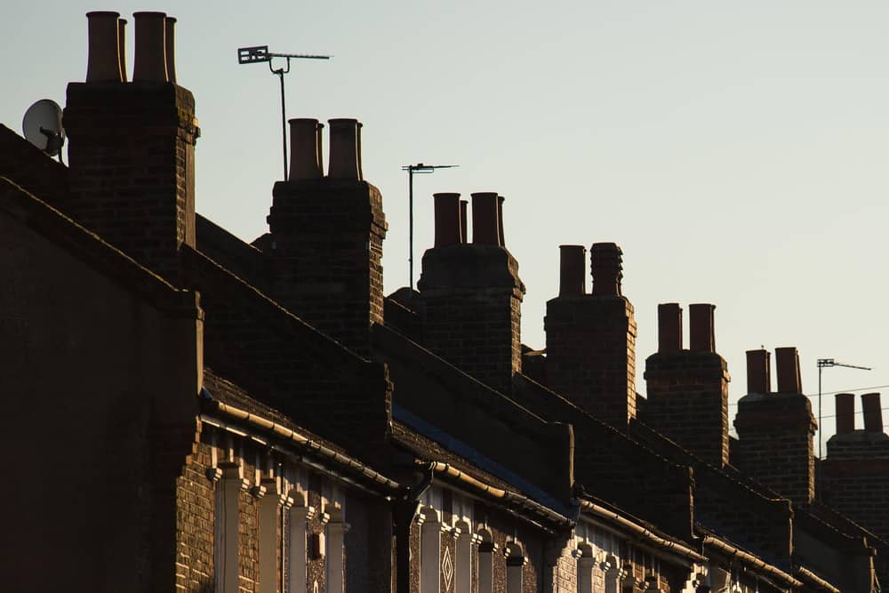 Chimneys on a row of terraced residential houses. Photo credit: Dominic Lipinski/PA Wire