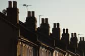 Chimneys on a row of terraced residential houses. Photo credit: Dominic Lipinski/PA Wire