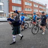A piper escorts members of the Falklands 40 Cyclists to the service at Old Portsmouth. 
Picture: Mike Cooter