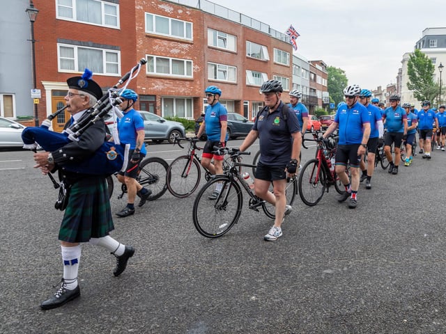 A piper escorts members of the Falklands 40 Cyclists to the service at Old Portsmouth. 
Picture: Mike Cooter