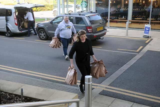 Pictured is: SAS hero Phil Campion and Penny Mordaunt MP unloading the van at 1000 Lakeside.

Picture: Sarah Standing (070322-390)