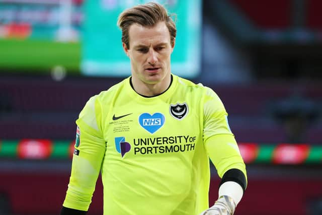 Pompey keeper Craig MacGillivray dejected after the defeat to Salford, having been his side's man of the match. Picture: Joe Pepler