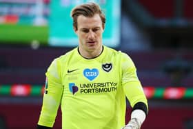Pompey keeper Craig MacGillivray dejected after the defeat to Salford, having been his side's man of the match. Picture: Joe Pepler