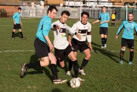 Jordan Shuttleworth (blue) was on target as Burrfields defeated Wymering 4-1.
Picture: Duncan Shepherd