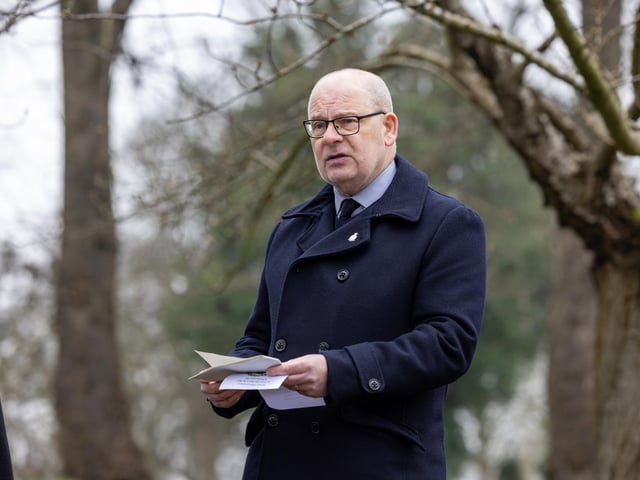 Gareth Lewis - Chairman of Pompey Pals - giving a reading at the Service of Remembrance. Picture: Mike Cooter (110324)