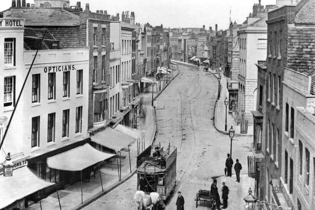 This wonderful shot taken from the top of the Square Tower is of High Street, Old Portsmouth, as it looked before the Luftwaffe changed it forever. In fact it was taken before the First World War. All the buildings on the left were destroyed, an area that is now part of Cathedral Green. The clock tower of the cathedral can be seen peeking over the rooftops, top left.