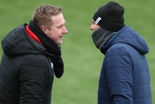 Hawks boss Paul Doswell, right, and Ebbsfleet manager Dennis Kutrieb were involved in a heated exchanged when the teams last met in February. Picture: Dave Haines