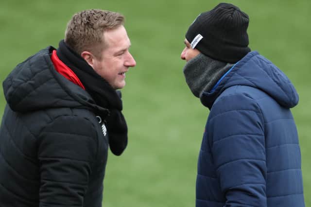 Hawks boss Paul Doswell, right, and Ebbsfleet manager Dennis Kutrieb were involved in a heated exchanged when the teams last met in February. Picture: Dave Haines