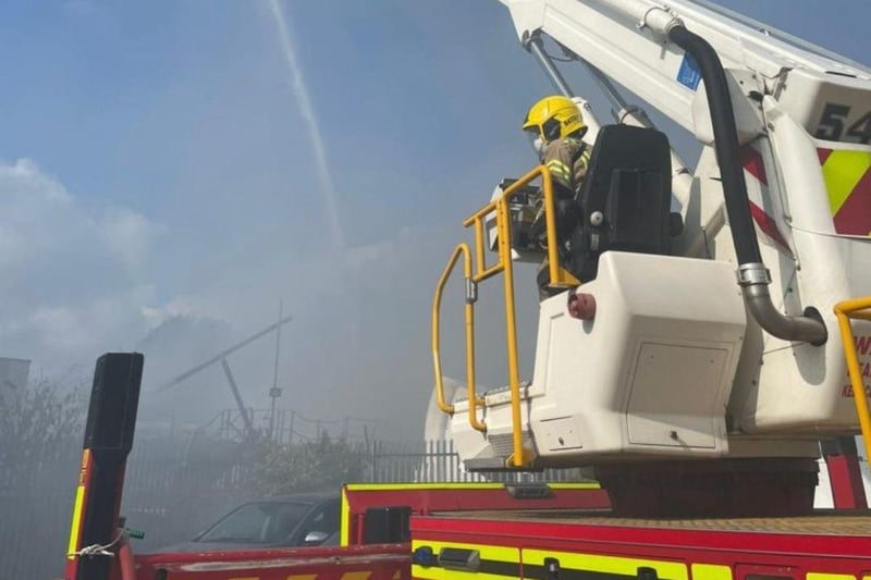 More than 80 firefighters were deployed to tackle a ferocious garage fire, which spread to nearby vehicles and buildings. Smoke could be seen filling the sky.