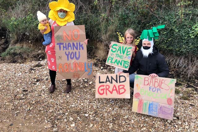 Protestors make their voices heard over the plans for Aquind to run interconnector cables through Portsmouth - Alida Payson and Eli Lazarus, with their children Emlyn, 6 months old, and Marjorie, 5 years old. Picture: Richard Lemmer