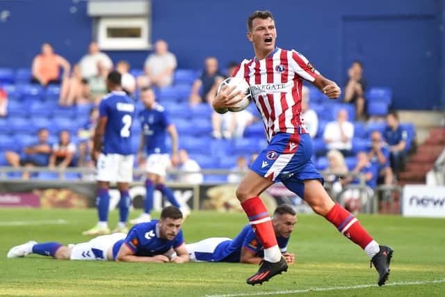 Alfie Rutherford celebrates a goal for Dorking Wanderers in August. (Photo by Richard Martin-Roberts/Getty Images).