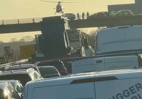 Air ambulance coming in to land on M27 after man falls from bridge