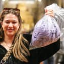 Morgan Reed with her bag of clothes to be weighed, and paid for by the kilogram.  Picture: Chris Moorhouse (010225-37)