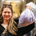 Morgan Reed with her bag of clothes to be weighed, and paid for by the kilogram.  Picture: Chris Moorhouse (010225-37)