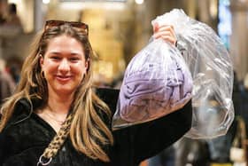 Morgan Reed with her bag of clothes to be weighed, and paid for by the kilogram.  Picture: Chris Moorhouse (010225-37)