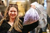 Morgan Reed with her bag of clothes to be weighed, and paid for by the kilogram.  Picture: Chris Moorhouse (010225-37)