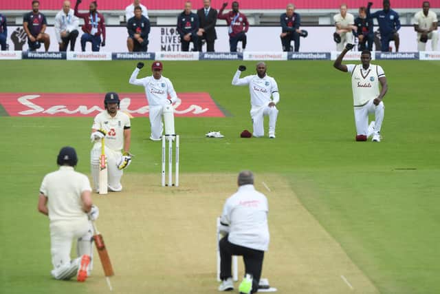Players and umpires take the knee prior to the start of an England v West Indies Test at Hampshire's Ageas Bowl last July. Photo by Stu Forster/Getty Images for ECB.