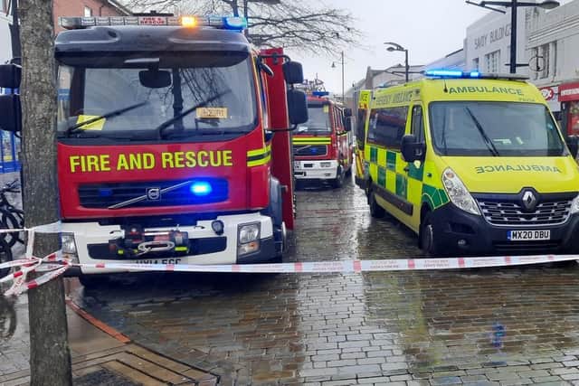 A woman has sustained 'serious' injuries after scaffolding was blown off a roof in West Street, Fareham. Police, fire crews are at the scene. The woman is being treated by paramedics.