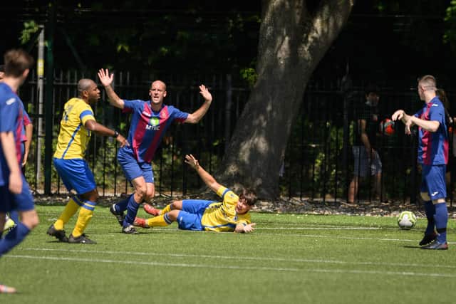 US Portsmouth's Tom Jeffes protests his innocence, but Locks are awarded a second penalty. Picture: Keith Woodland