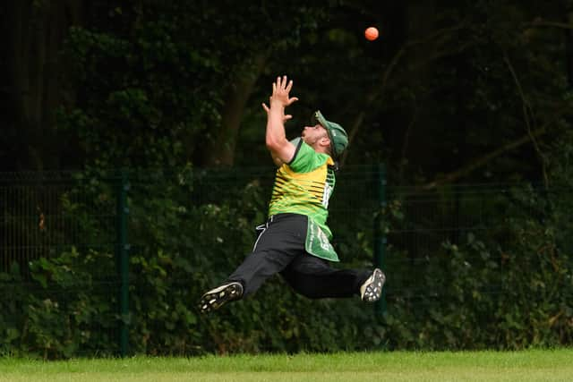 Sarisbury's Josh Hill throws the ball back to stop it going over the ropes.  Picture: Keith Woodland