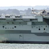 Engineers inspect aircraft carrier HMS Prince of Wales as it sits off the coast of Gosport Picture: Gareth Fuller/PA Wire