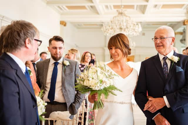 Georgie with her dad on her wedding day. Credit: Carla Mortimer Wedding Photography