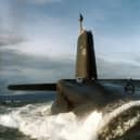 A sailor aboard HMS Vanguard has been arrested over a suspected bomb hoax on the nuclear submarine.