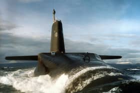 A sailor aboard HMS Vanguard has been arrested over a suspected bomb hoax on the nuclear submarine.