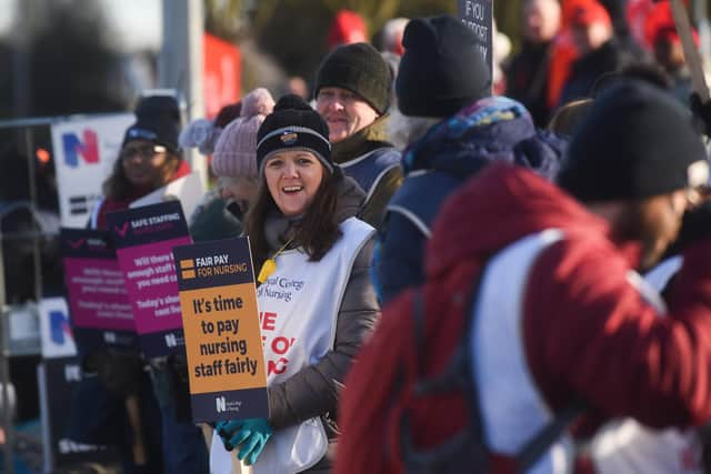 Royal College of Nursing picket line as staff strike outside a hospital.