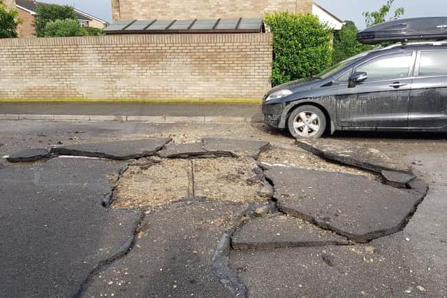 A car in Schooner Way, Milton, Portsmouth, appears to have had a lucky escape after a bolt of lightning allegedly struck the road during a storm in the early hours of Tuesday, July 27, 2021. Picture: Puzzling Concepts (@selzzup via Twitter)