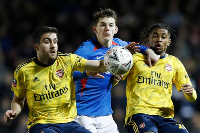 Steve Seddon battles with Arsenal's Sokratis Papastathopoulos and Reiss Nelson in last season's FA Cup clash during his successful Fratton Park loan spell. Picture: Adrian Dennis/AFP via Getty Images.