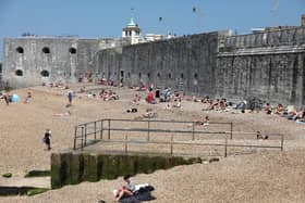 Beach revellers gather at the Hot Walls in Old Portsmouth.