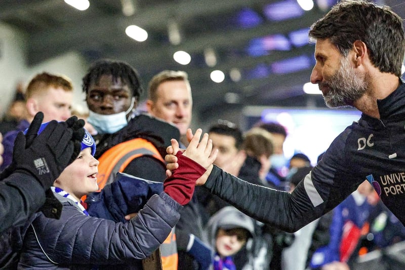 Danny Cowley hands his tracksuit to a young fan after the Blues' goalless draw at AFC Wimbledon.