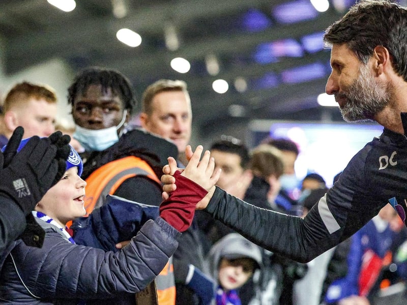 Danny Cowley hands his tracksuit to a young fan after the Blues' goalless draw at AFC Wimbledon.