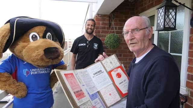 Former Pompey winger John McClelland showed Christian Burgess his programme collection after the Blues defender dropped off his medicine