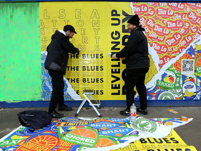 Ashley John, left, and George Bodkin with their Pompey themed fruit stickers. Picture: Chris Moorhouse (jpns 250223-23)