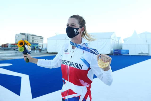 Eilidh McIntyre shows off her gold medal. Photo by Clive Mason/Getty Images.