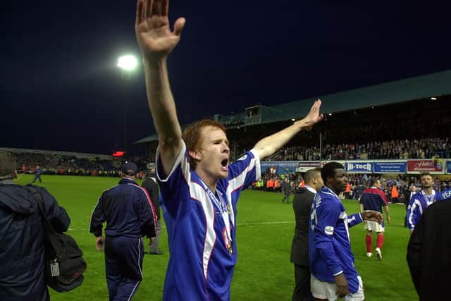 Hayden Foxe celebrates after Pompey claim the 2002-03 Division One title following victory over Rotherham. Picture: Steve Reid