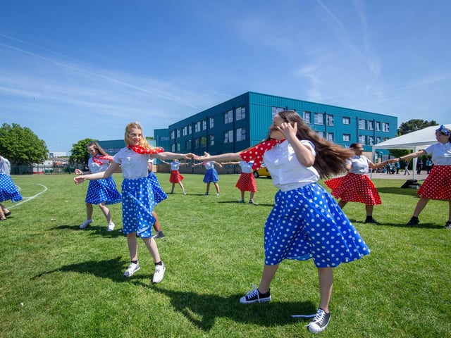 Dance students of Trafalgar School, Hilsea, Portsmouth celebrating outside their school