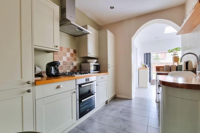 The kitchen is contemporary and has a lot of space.