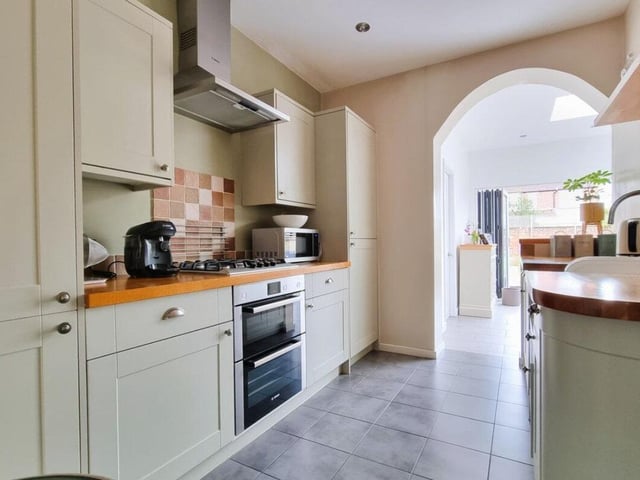 The kitchen is contemporary and has a lot of space.