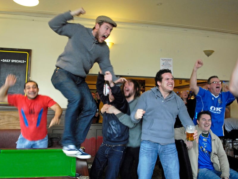 These Pompey fans celebrate the Blues' 4-1 win at Southampton in the FA Cup in 2010.